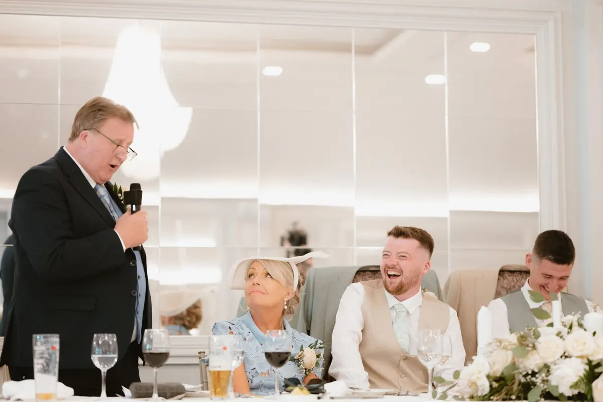A guest giving a speech beside the top table