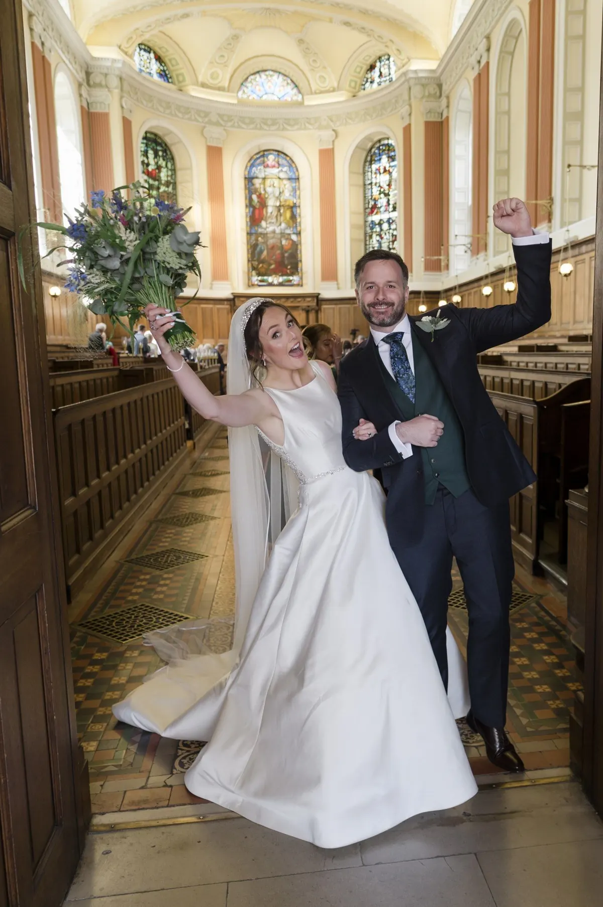 Carole and Stephen walking back through the chapel aisle