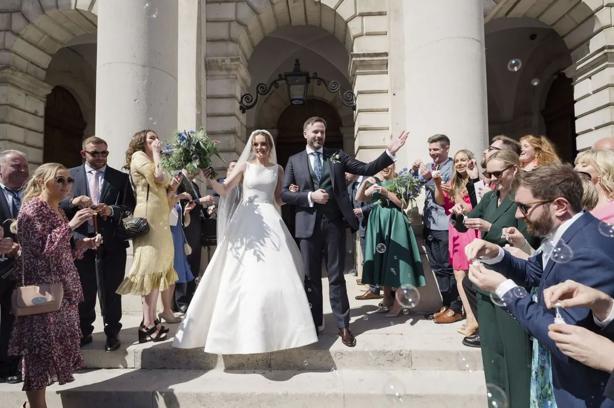 Guests congratulating Carole and Stephen outside in Front Square