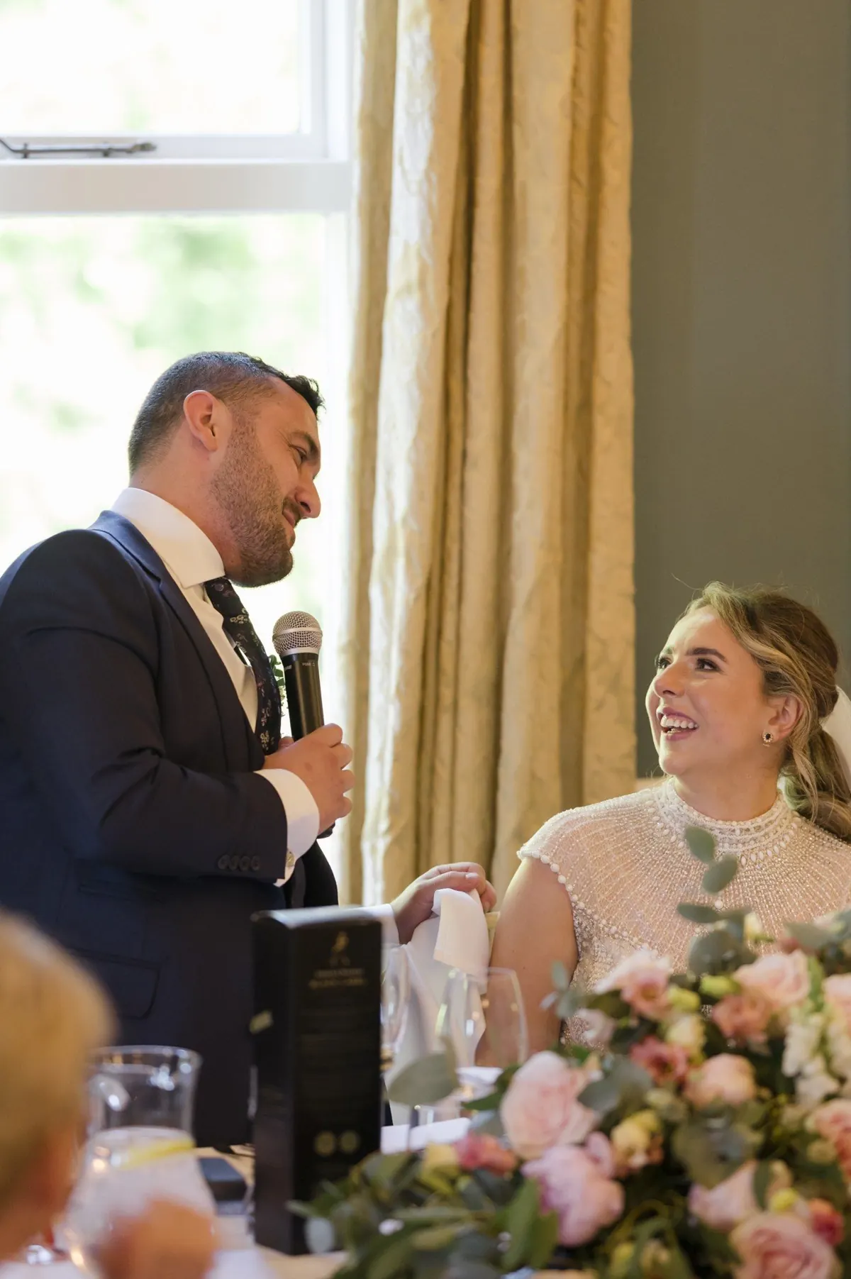 Ramon speaking beside Steph during the reception