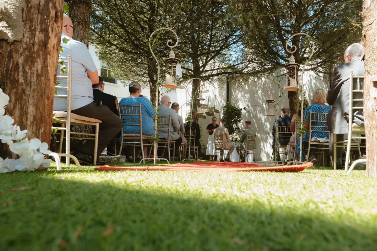 Low view across the lawn towards the outdoor ceremony
