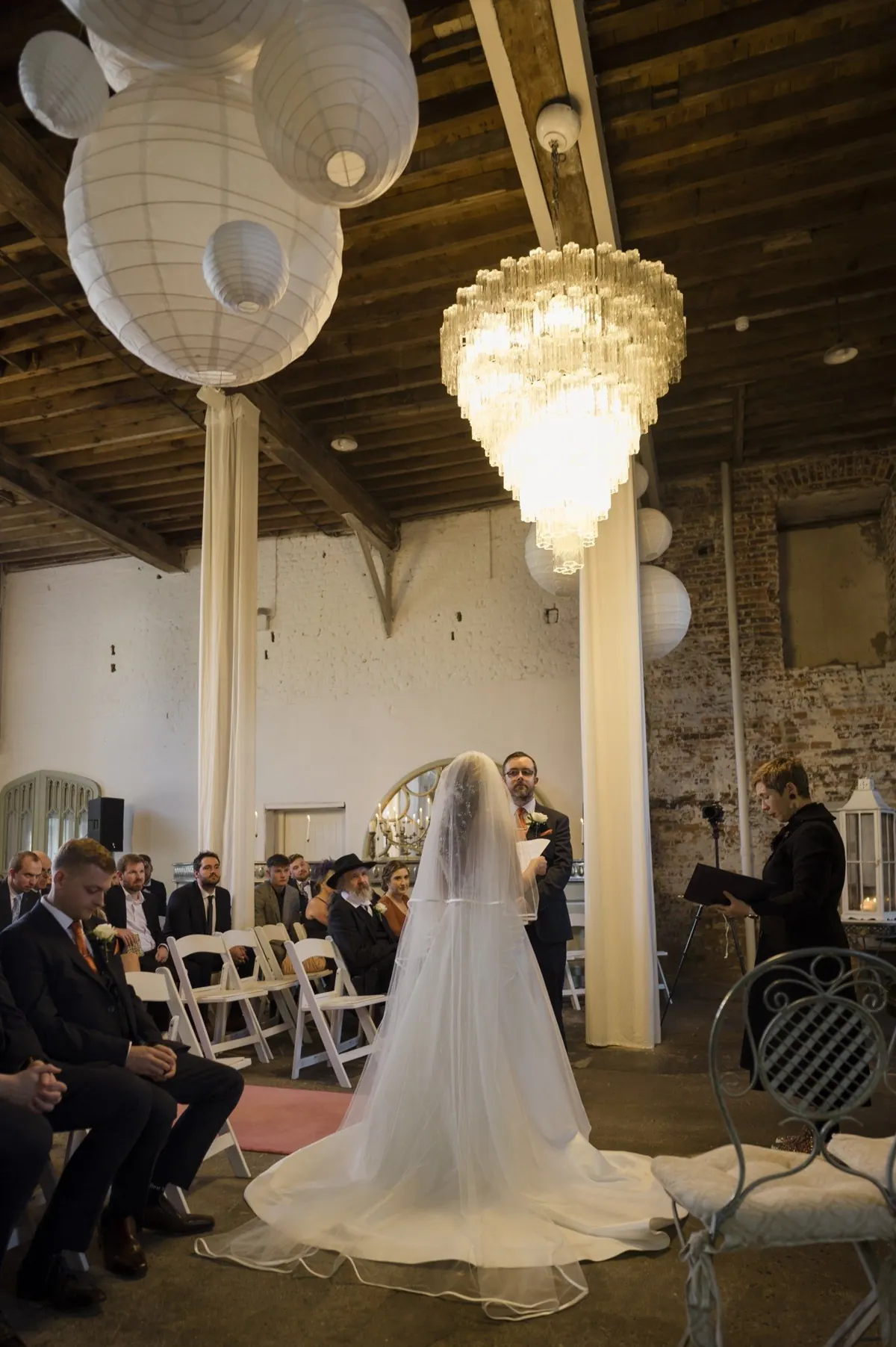 The ceremony beneath the high ceiling of the Old Mill