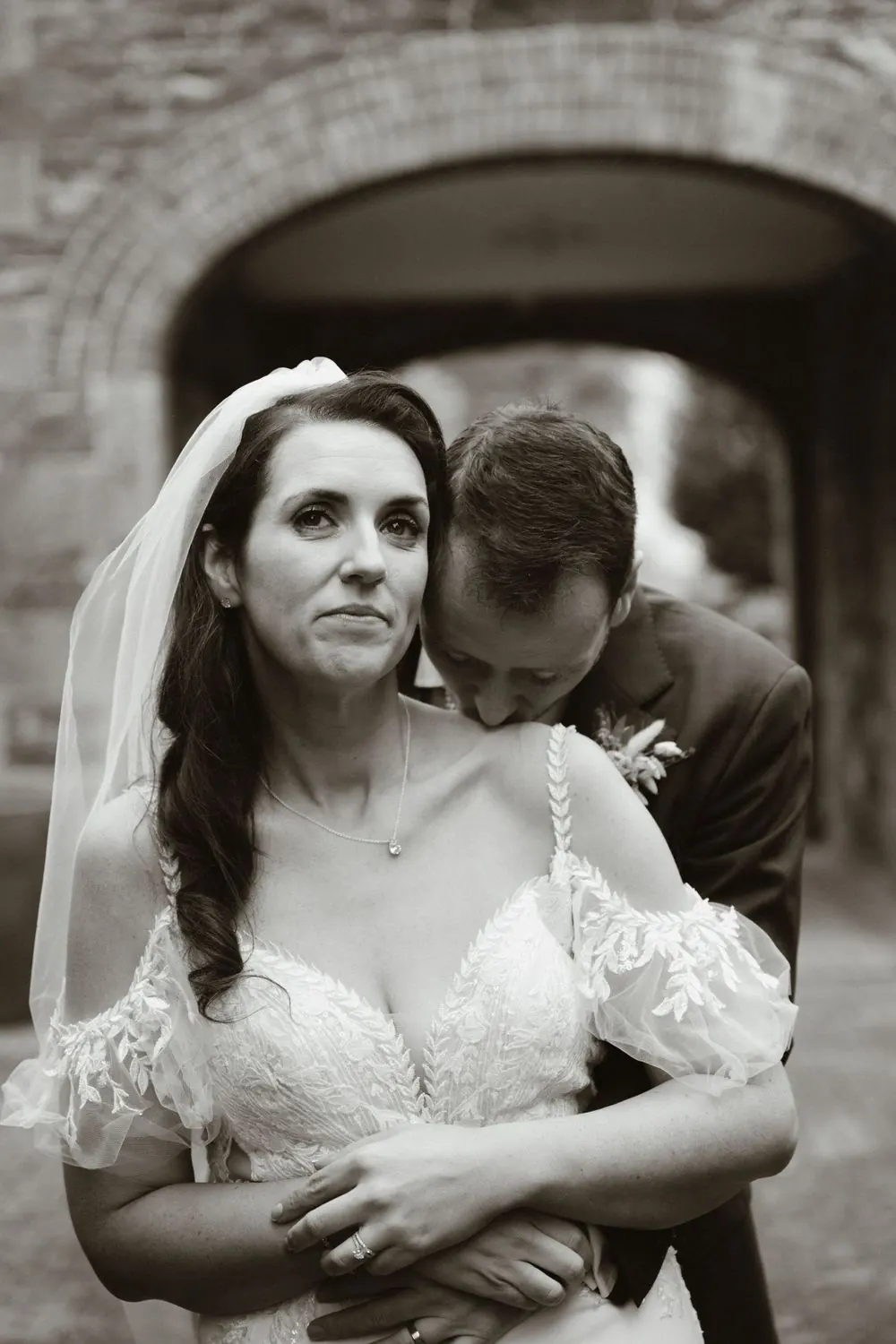 A close black-and-white portrait of Aine and John together.