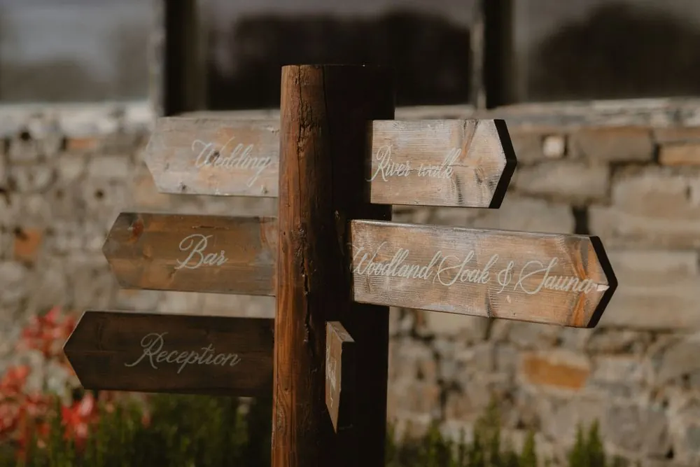 Rustic wooden wedding directional sign post with arrow signs at Boyne Hill House Estate, Co. Meath