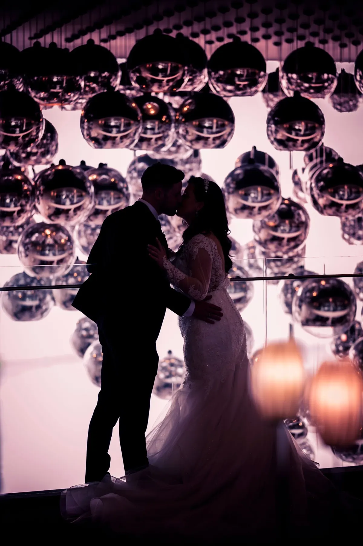 Michelle and Chris together in the hotel’s pink-lit interior.