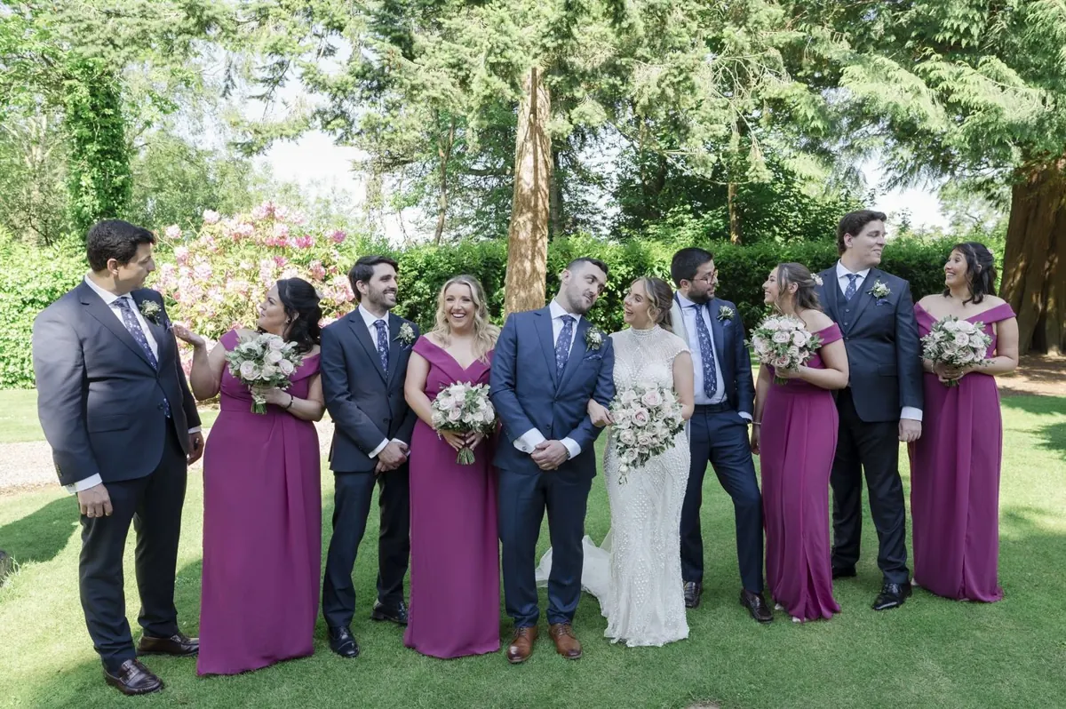 Steph and Ramon with their wedding party in the gardens