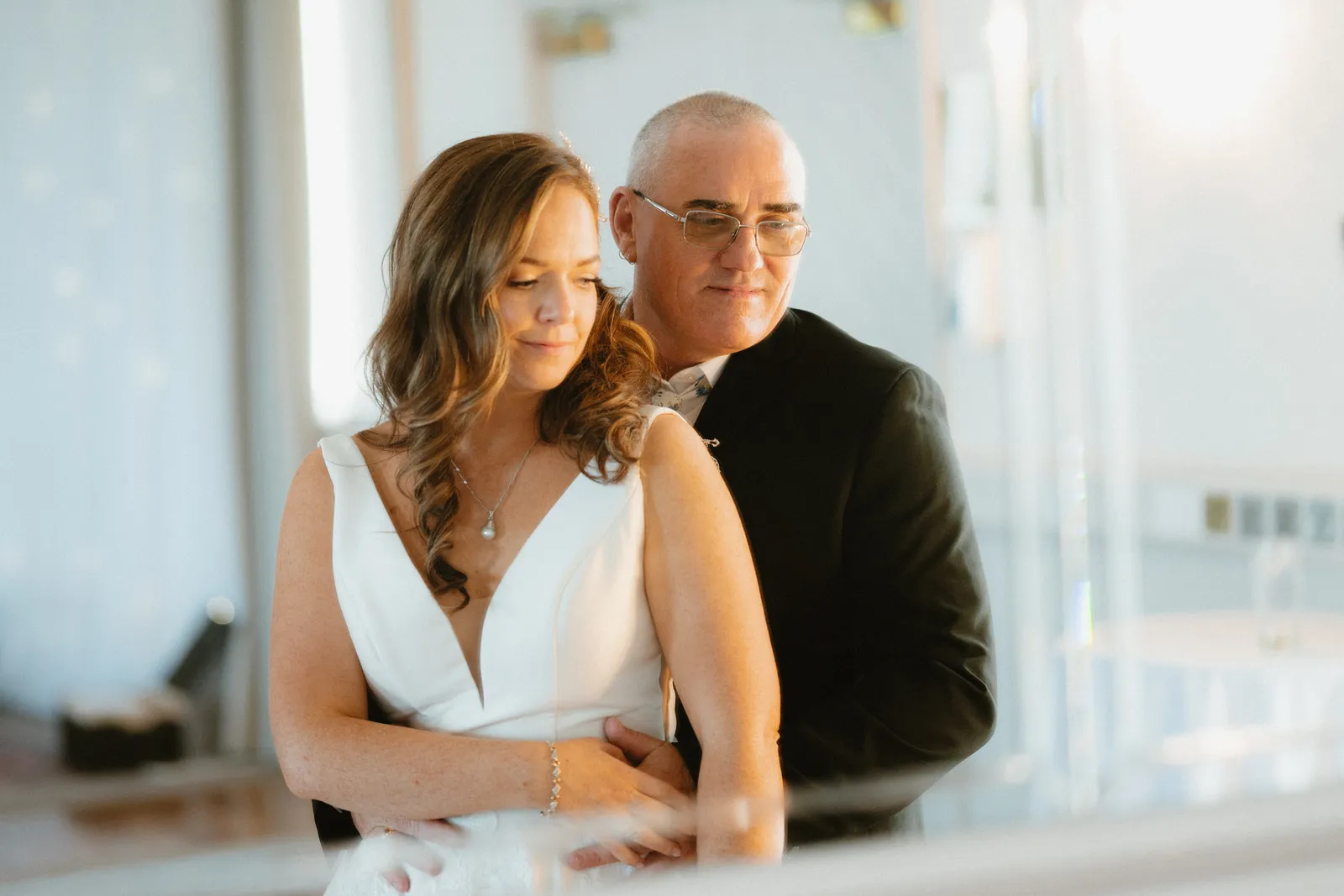 Alice and Darren together in soft reception-room window light