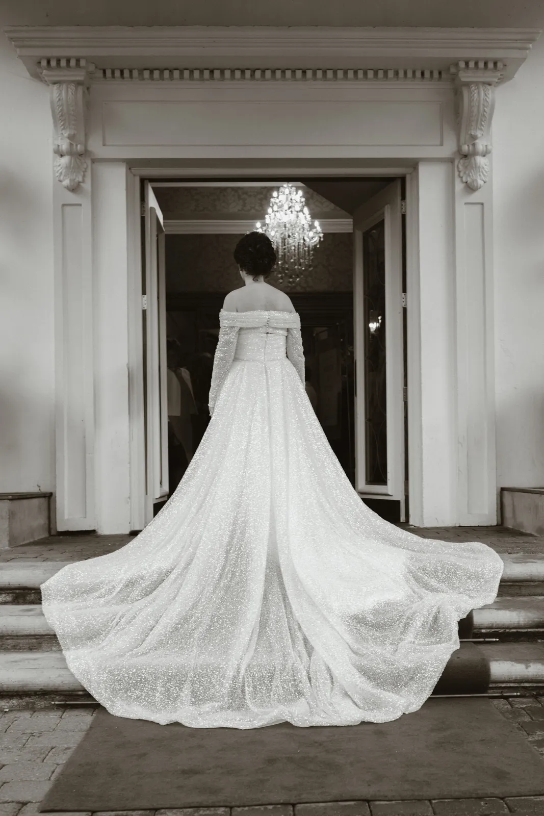 Andrea’s dress and train in a doorway