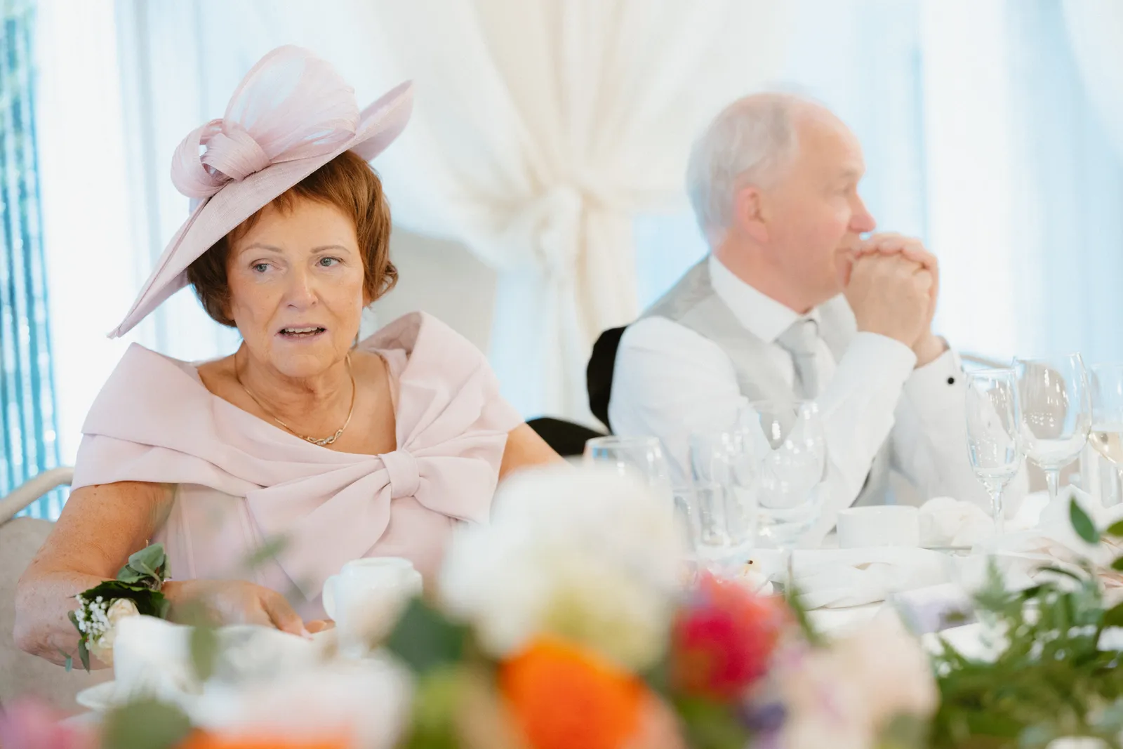 Guests listen at the reception table