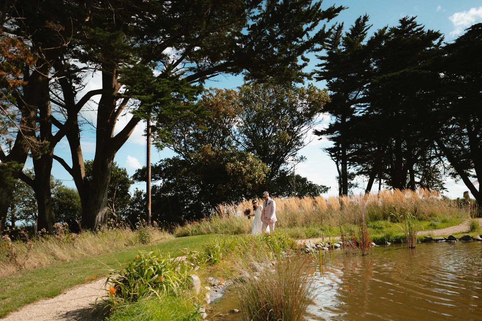 The couple beside the pond