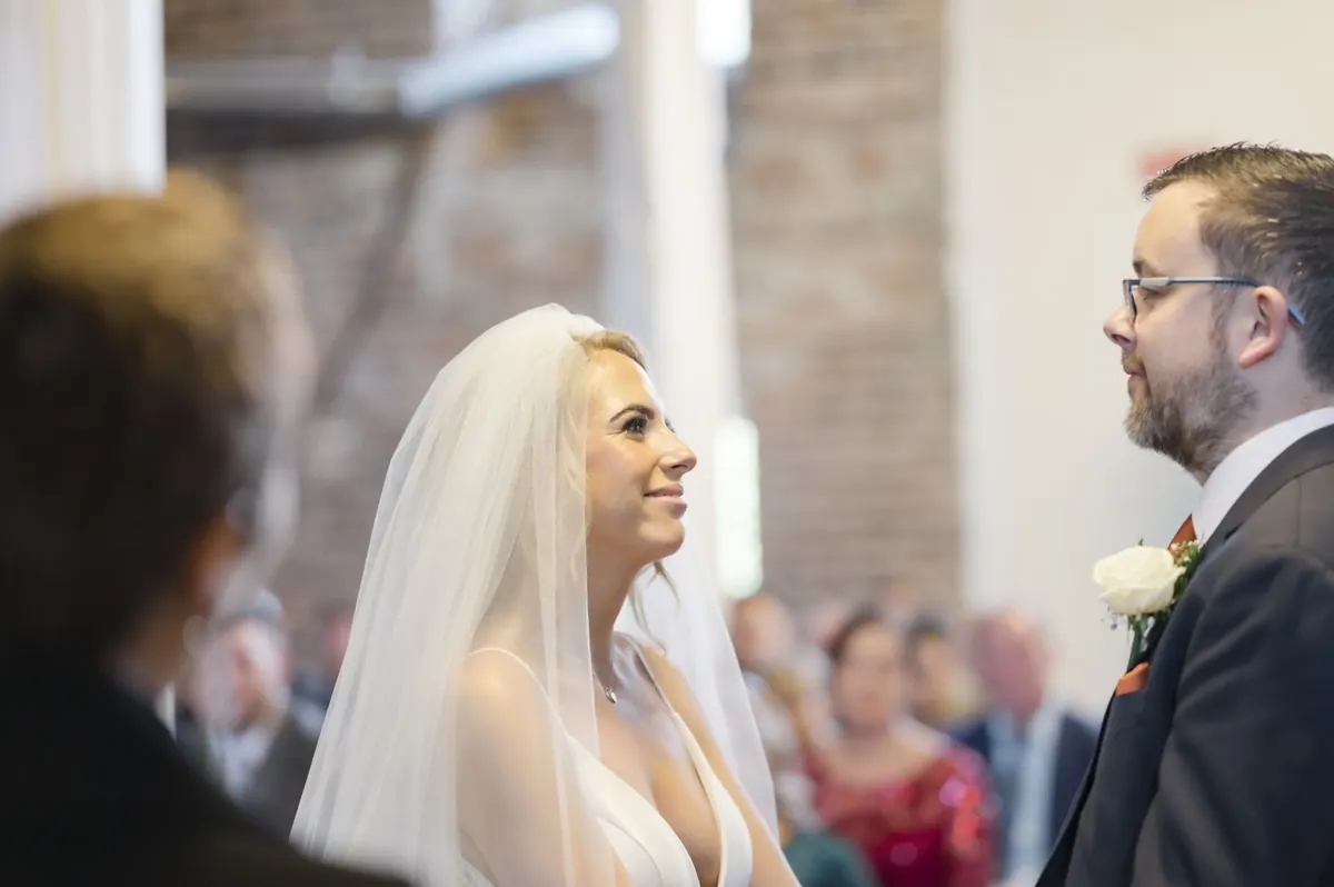 Charlie and Steven facing one another during the ceremony