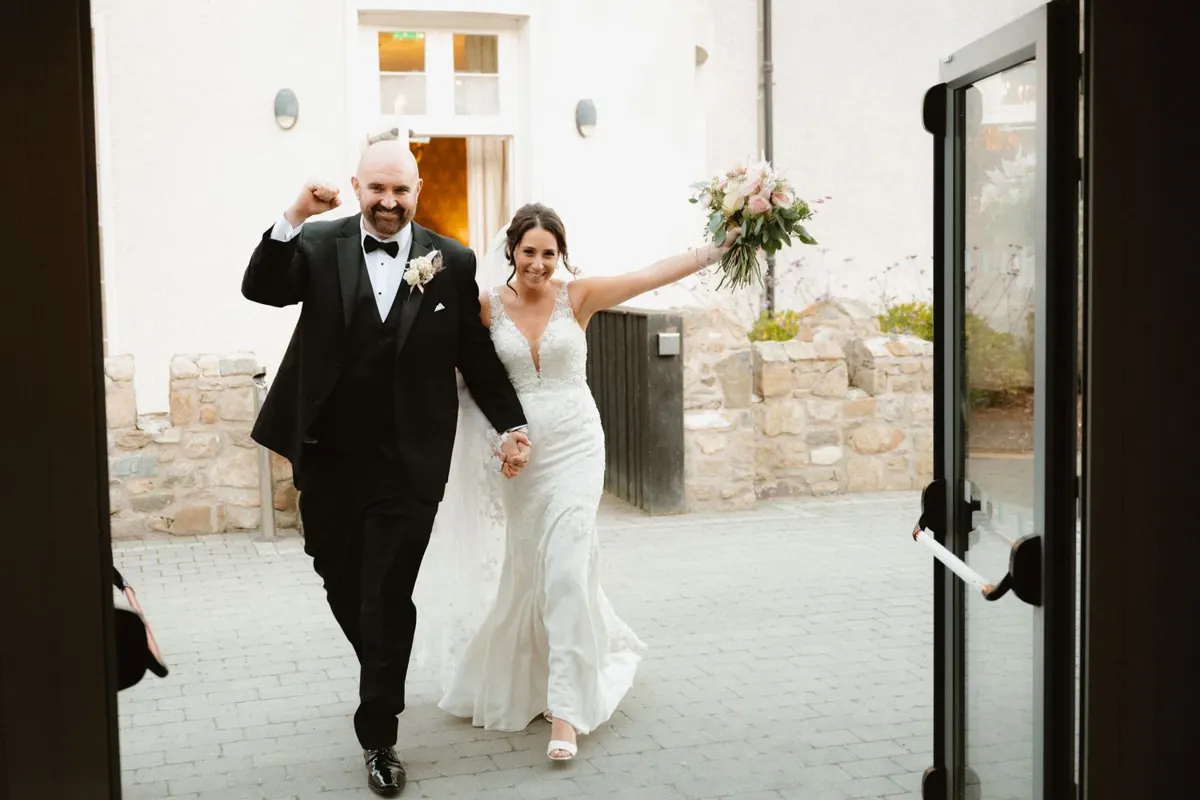 Bride and groom making their entrance at Killeavy Castle
