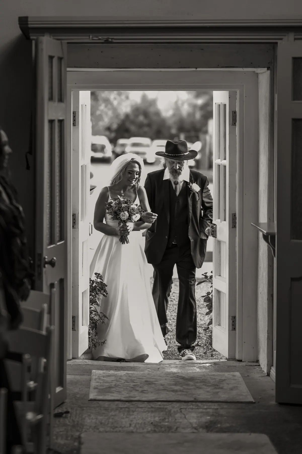 The bride approaching through the doorway for the ceremony