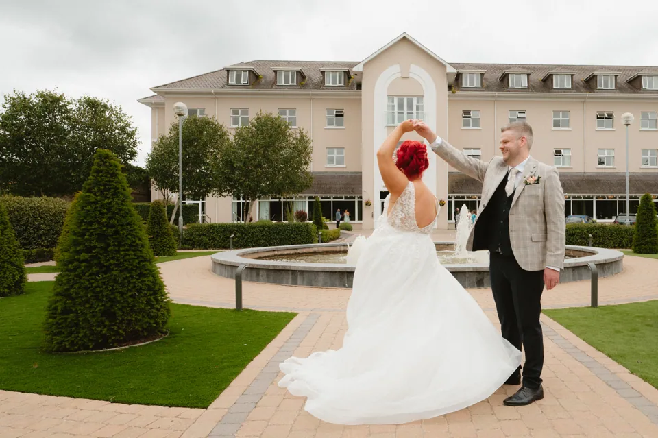 Belinda and Kevin turning beside the garden fountain