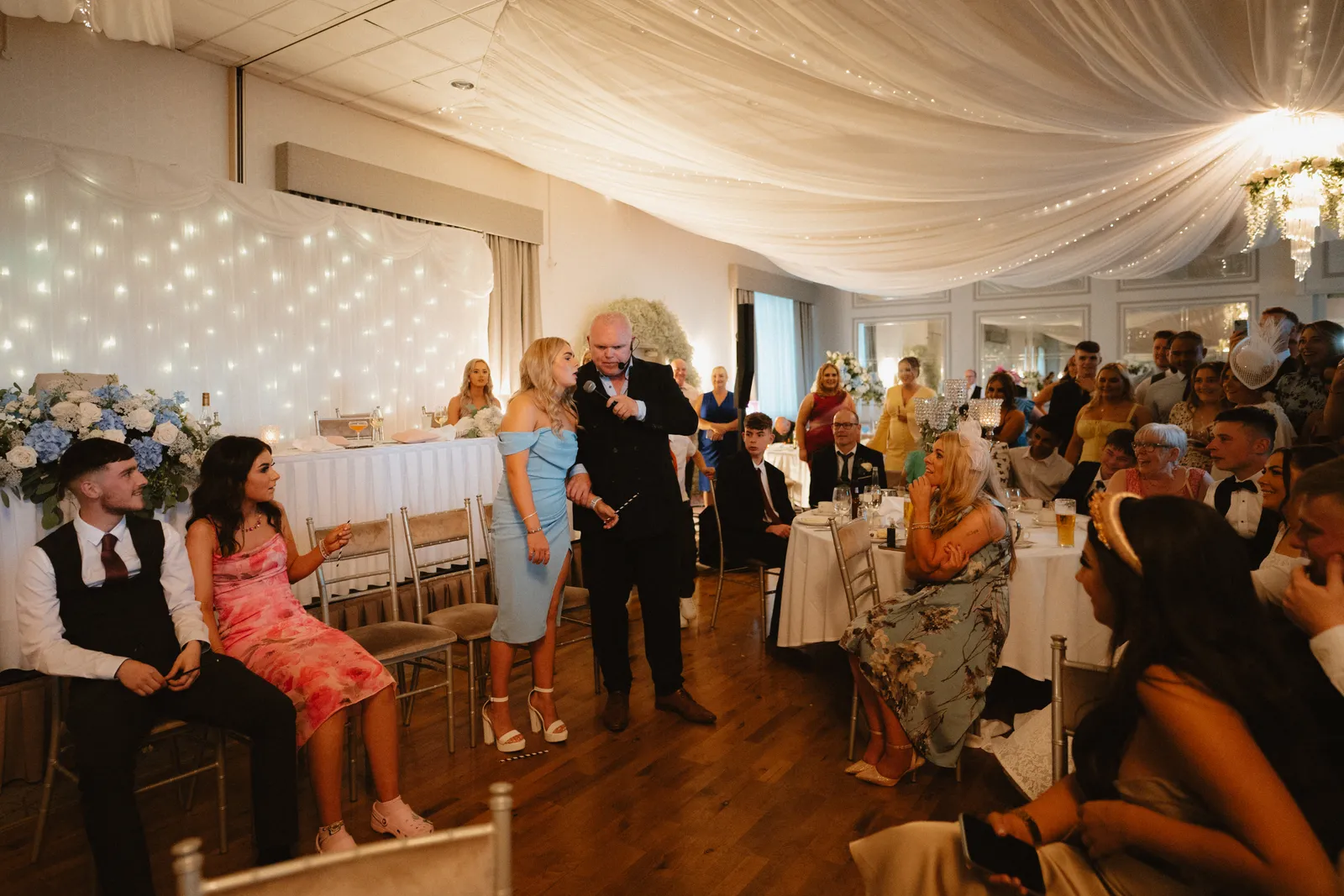 Guests joining in around the tables at Brogan and Thomas’s reception