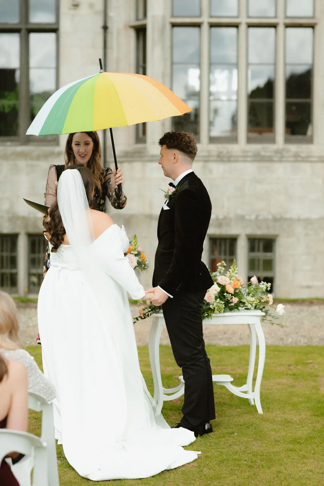 An umbrella held over the ceremony