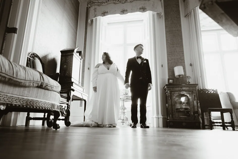 The couple together in a bright castle room