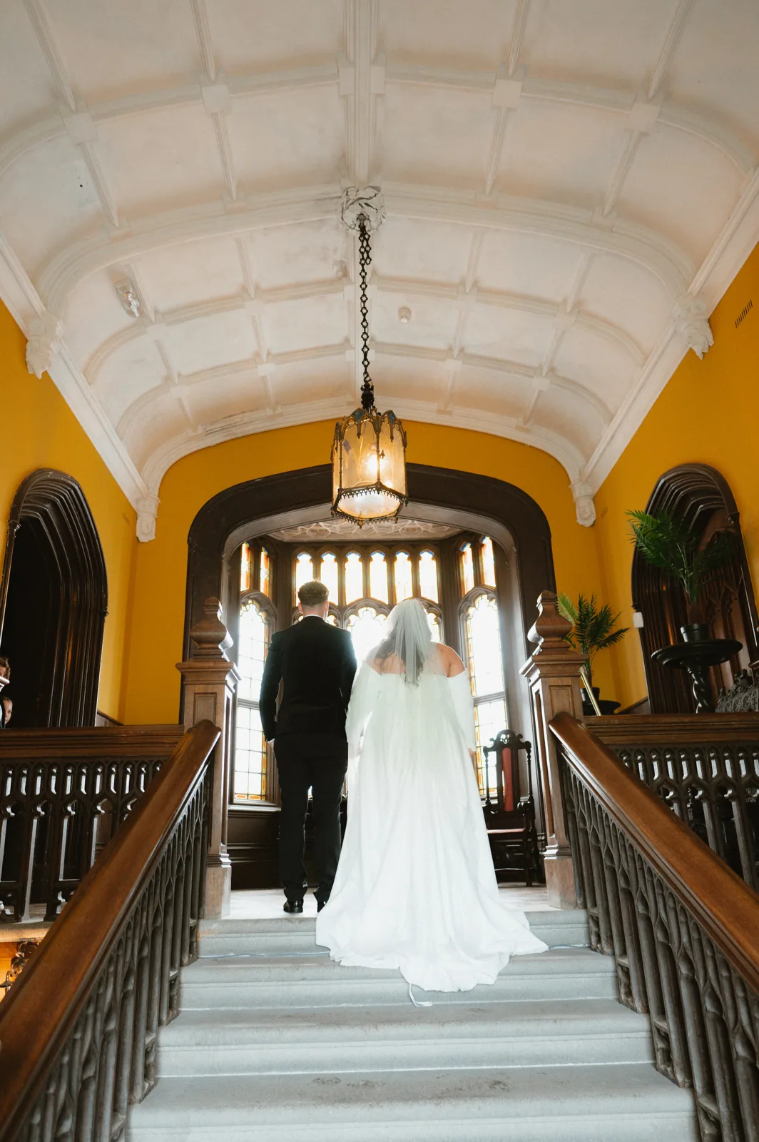 The couple framed by the castle hallway