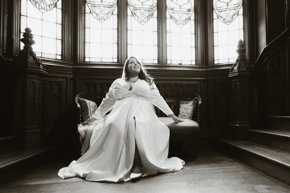 Brooke seated beneath a bright window