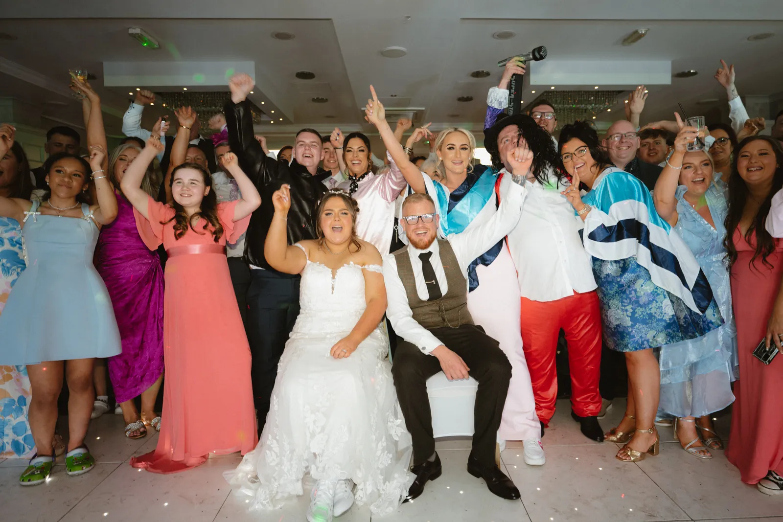 The couple with cheering guests