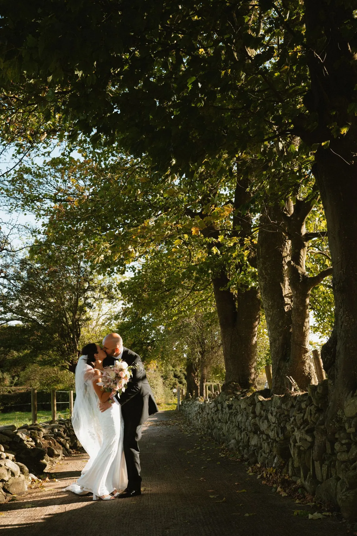 Bride walking outside Killeavy Castle during wedding portraits