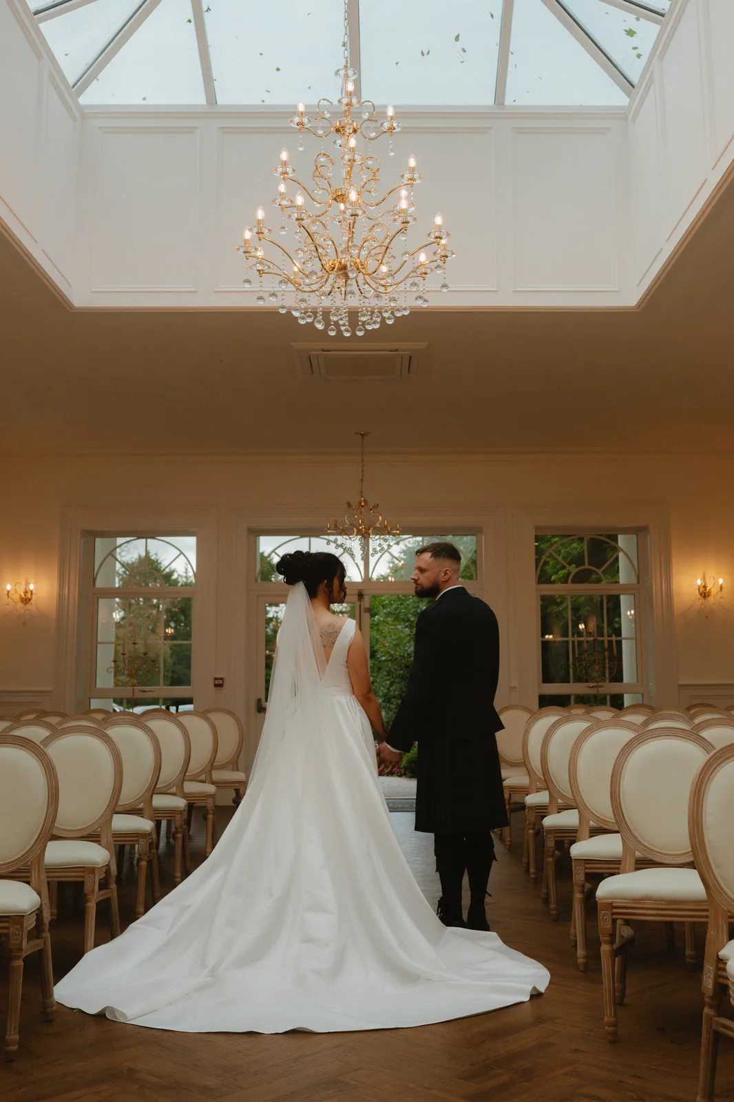 The couple beneath the glass roof
