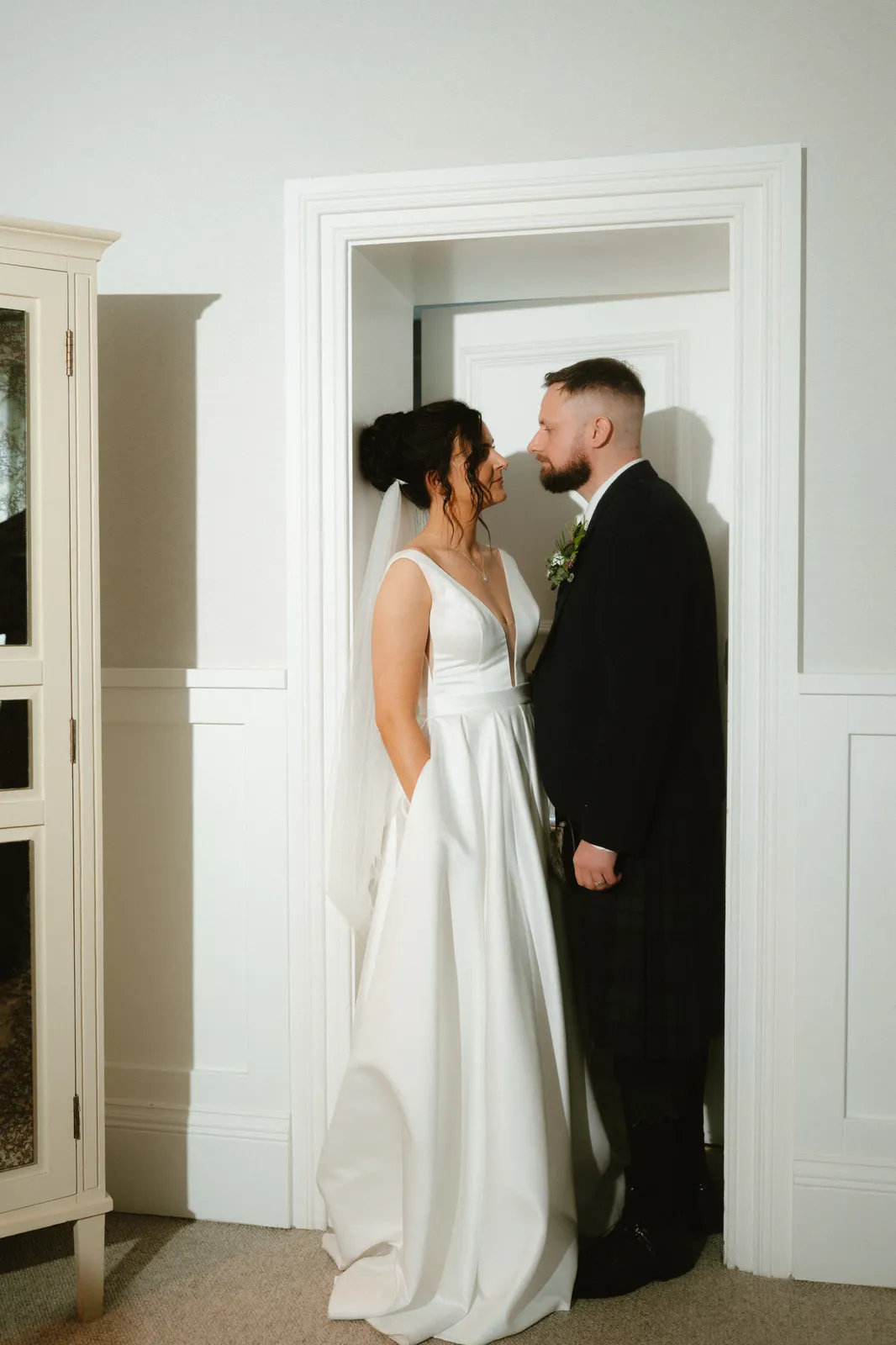 The couple framed by a doorway