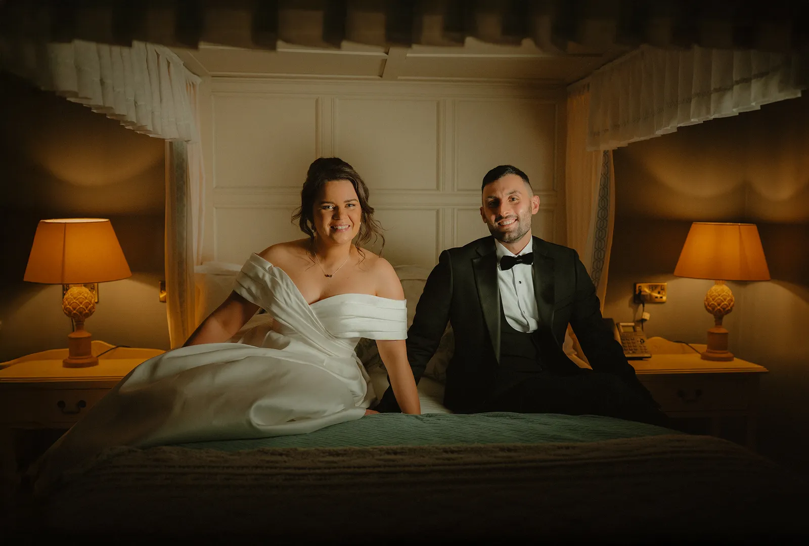 The couple sit together in a warmly lit room