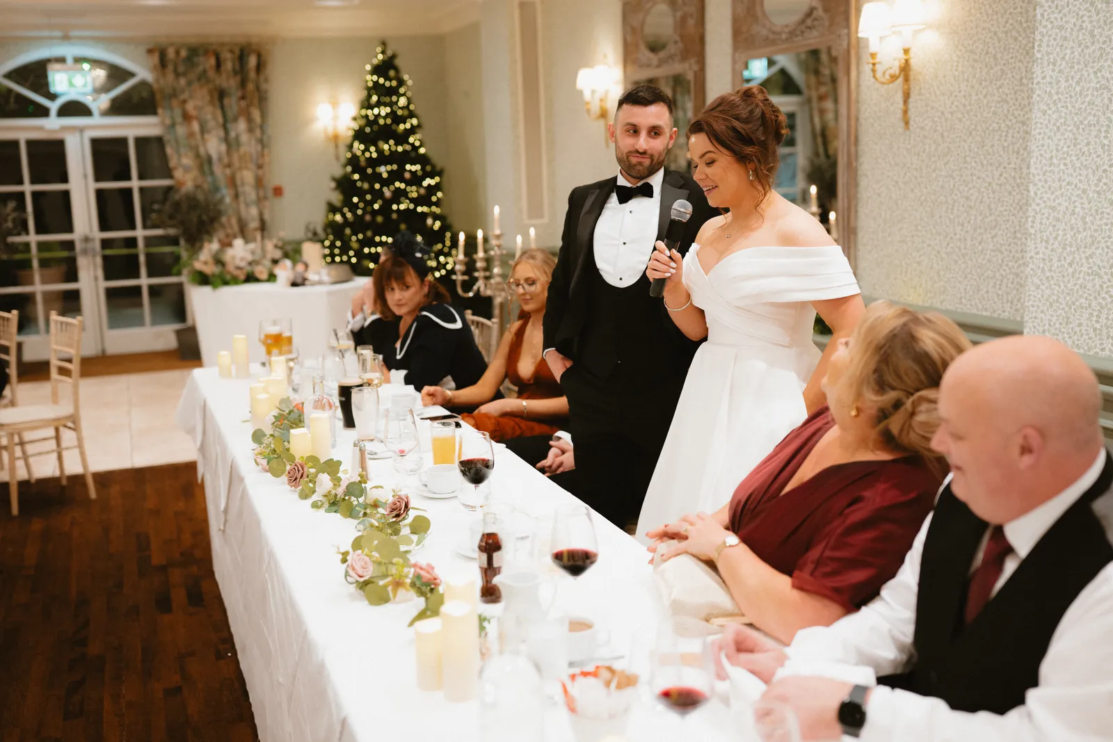 The couple stand at the top table