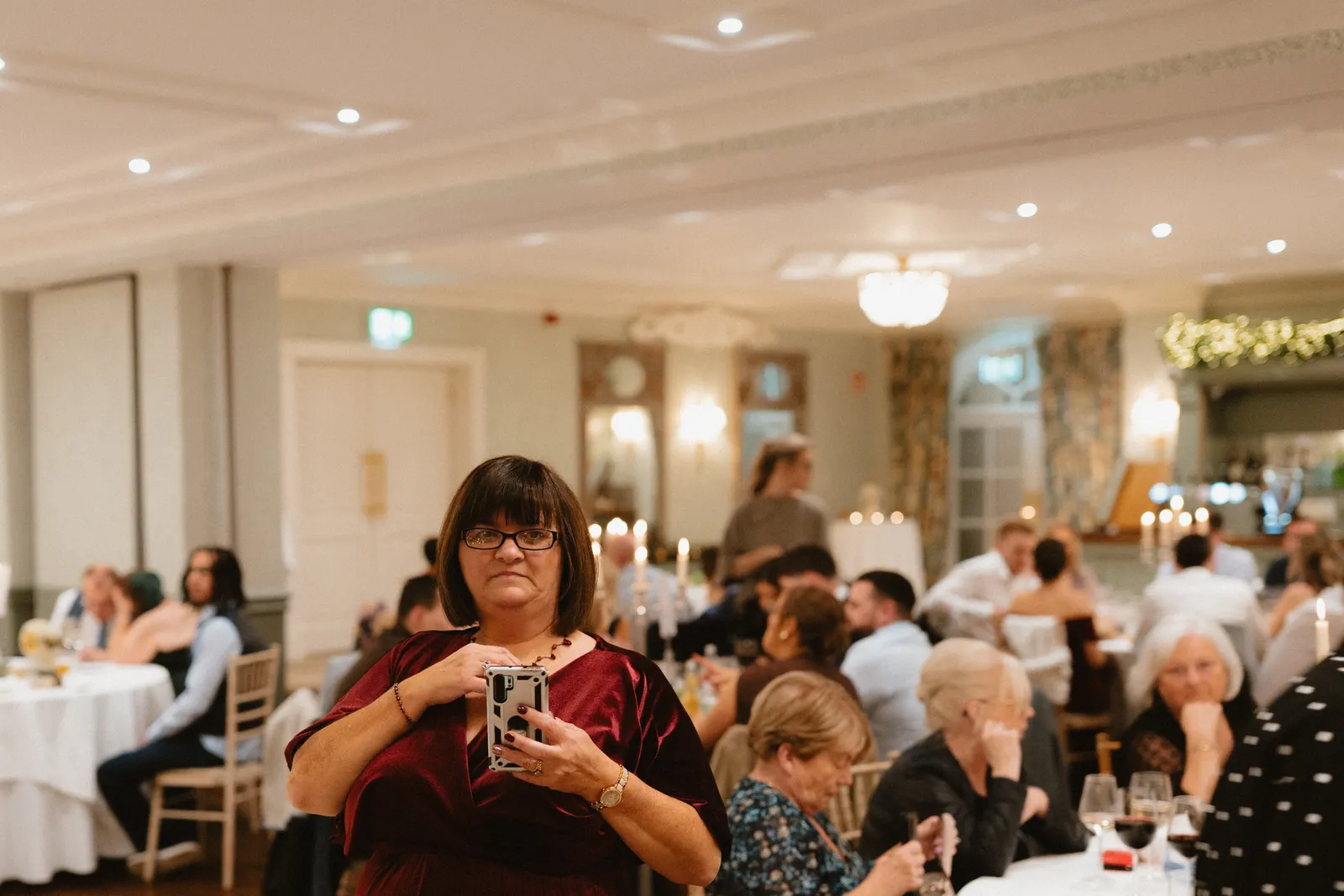 Guests listen in the reception room