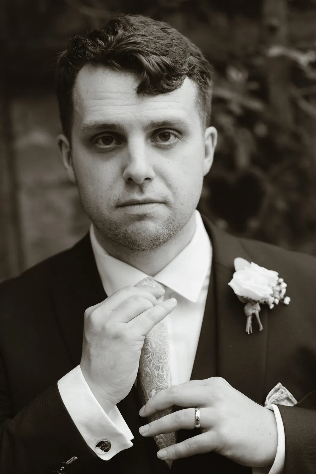Will adjusting his tie