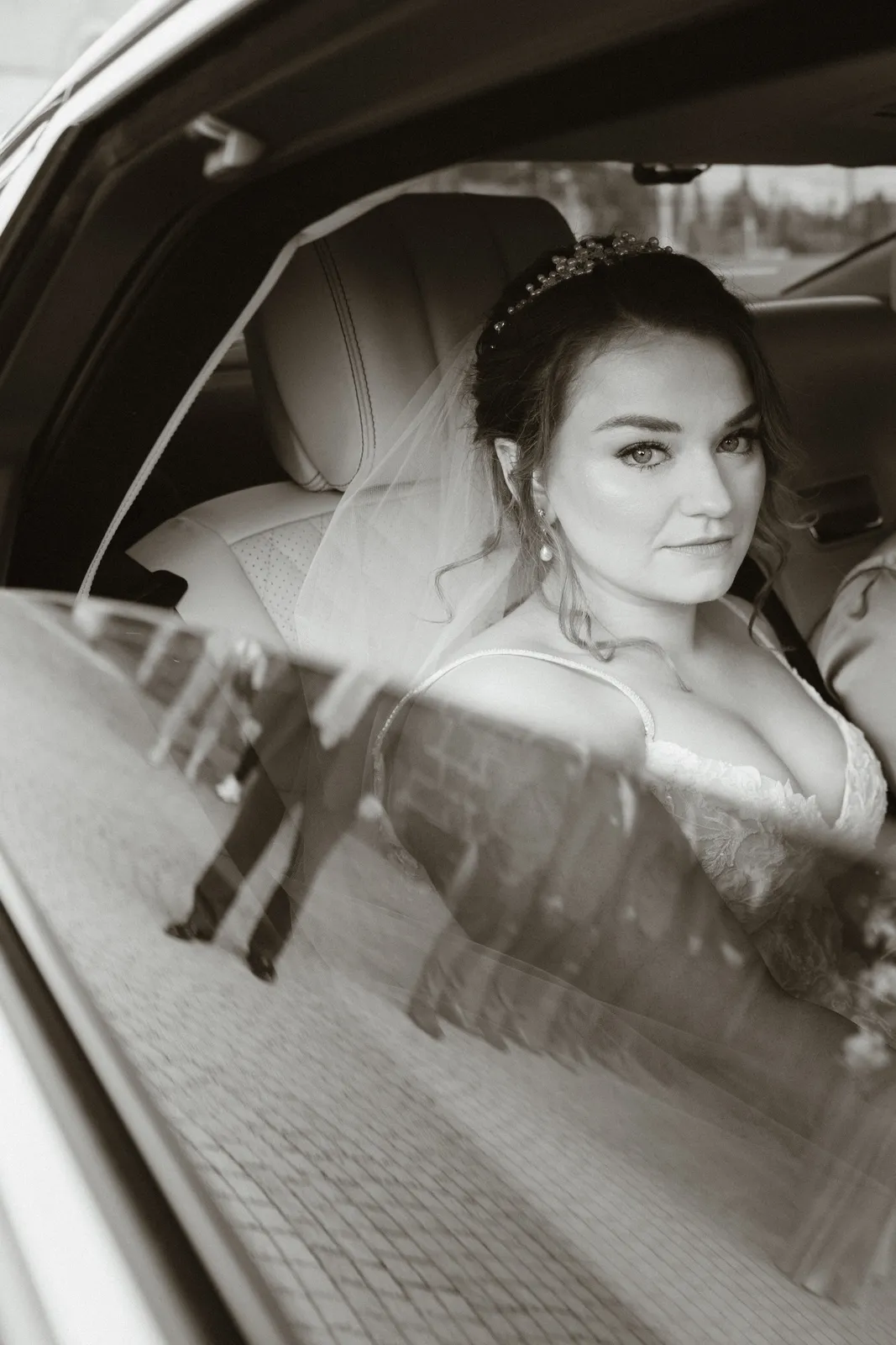 Claire seated in the wedding car