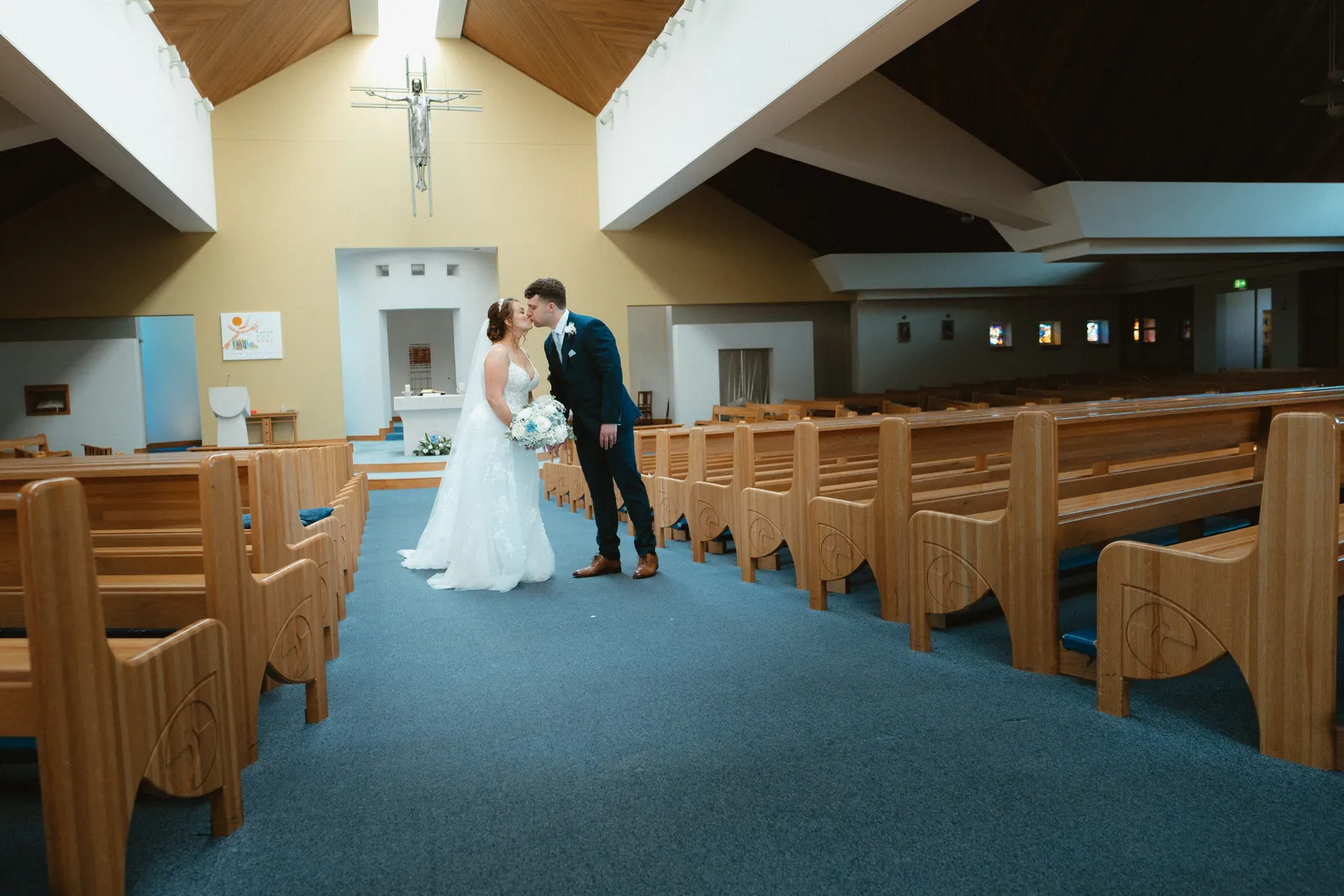 Wide view of the couple in the church