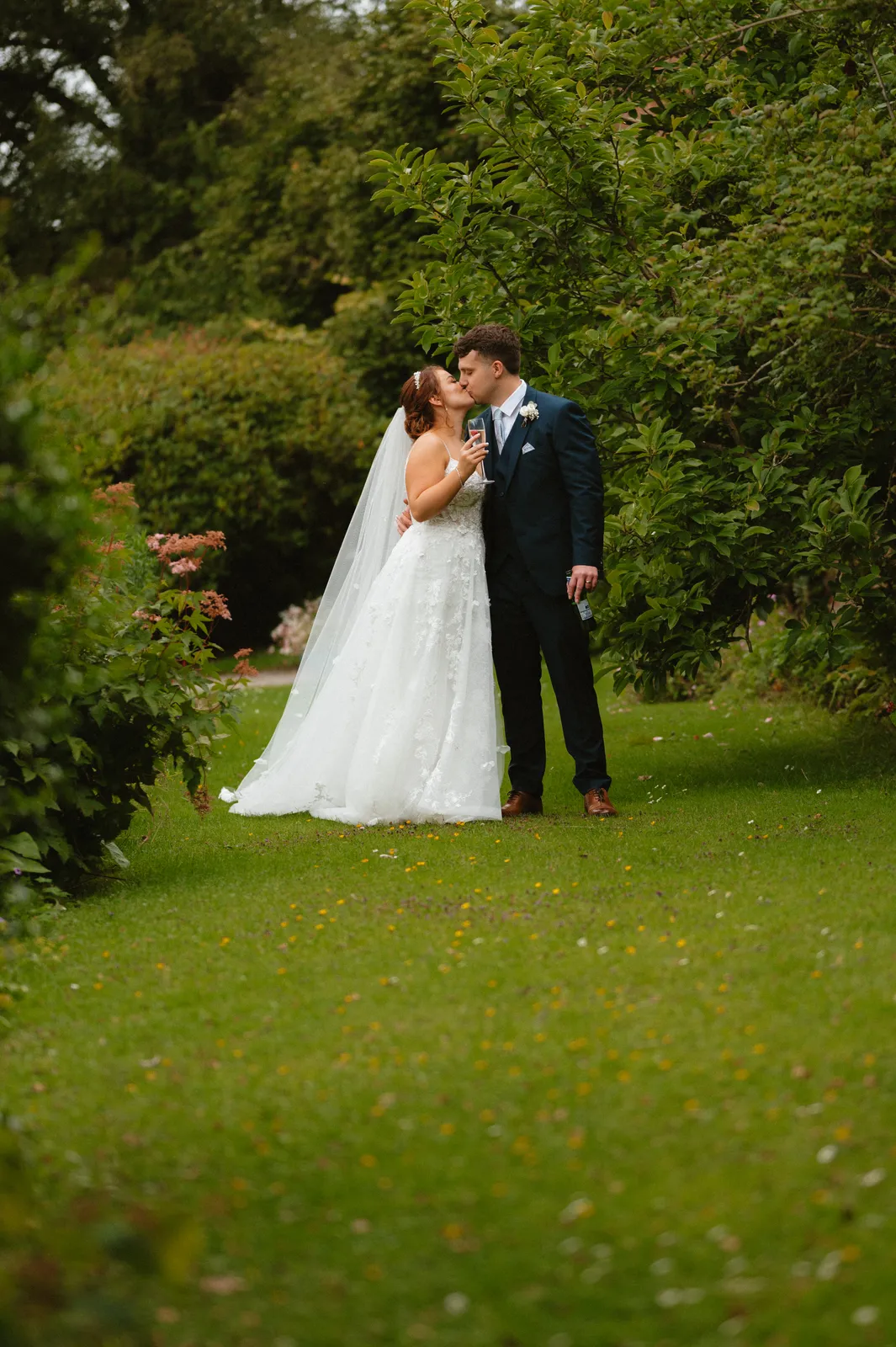 The couple together among the greenery
