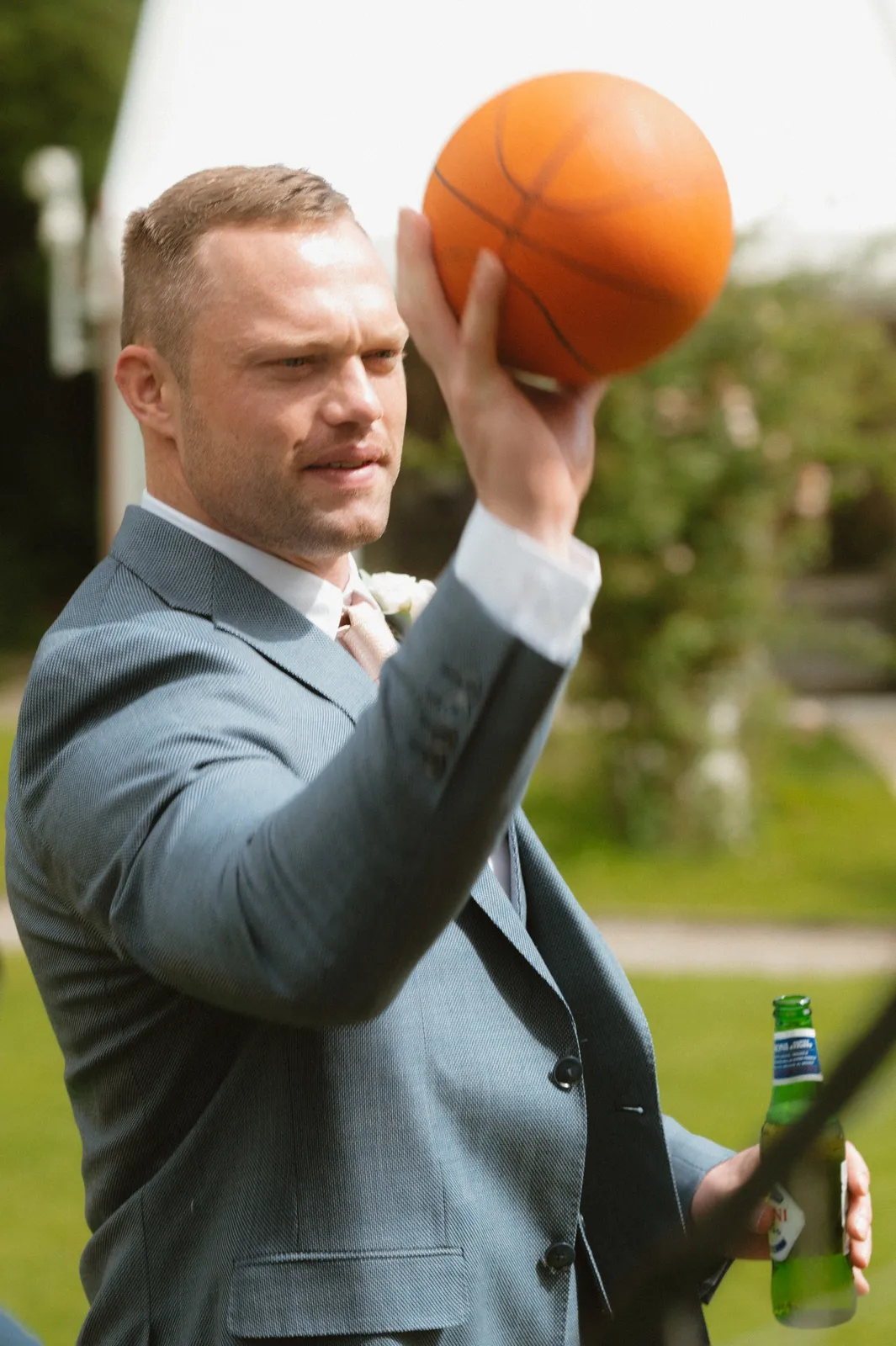 A guest holding an orange ball