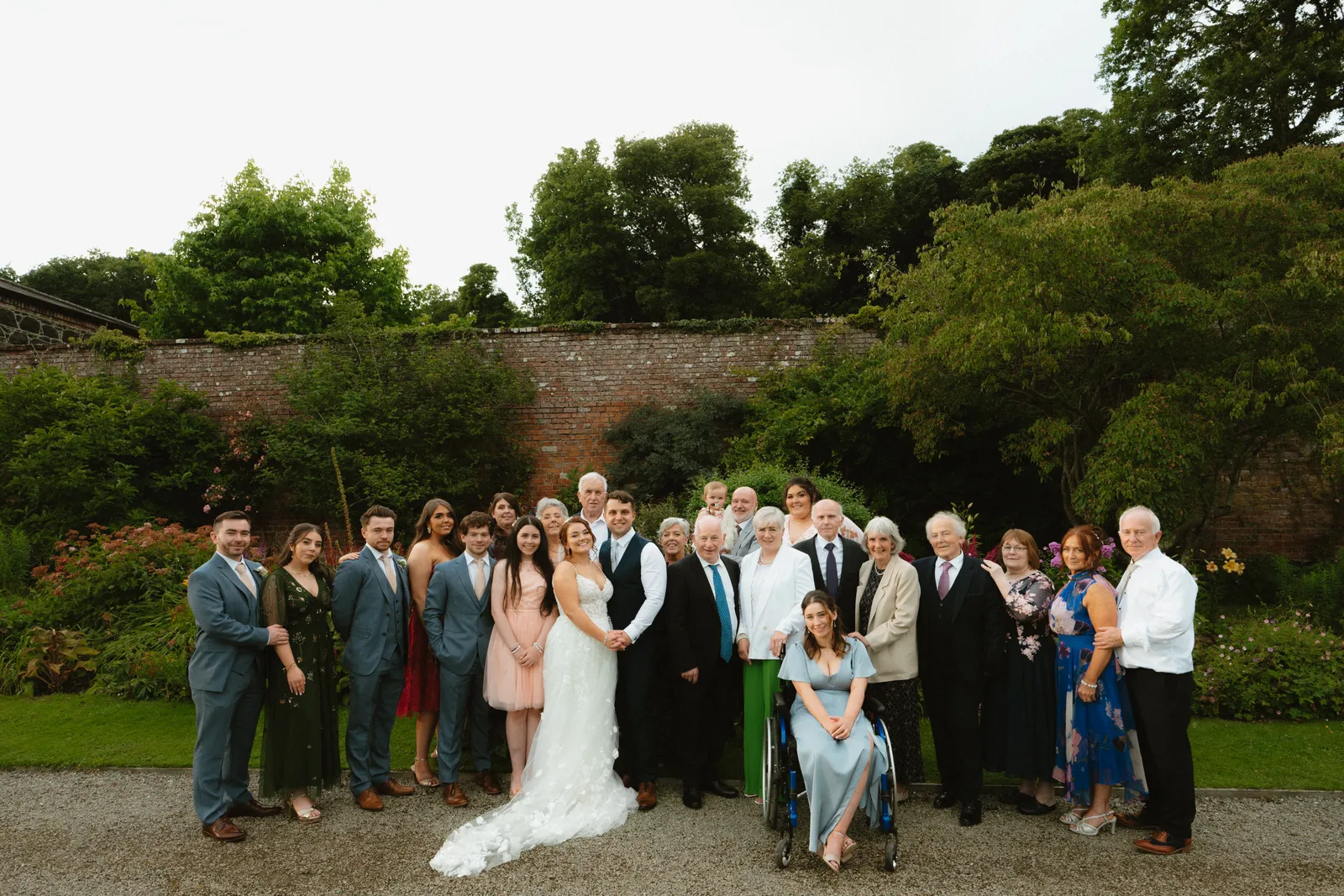 Group portrait beside the garden wall