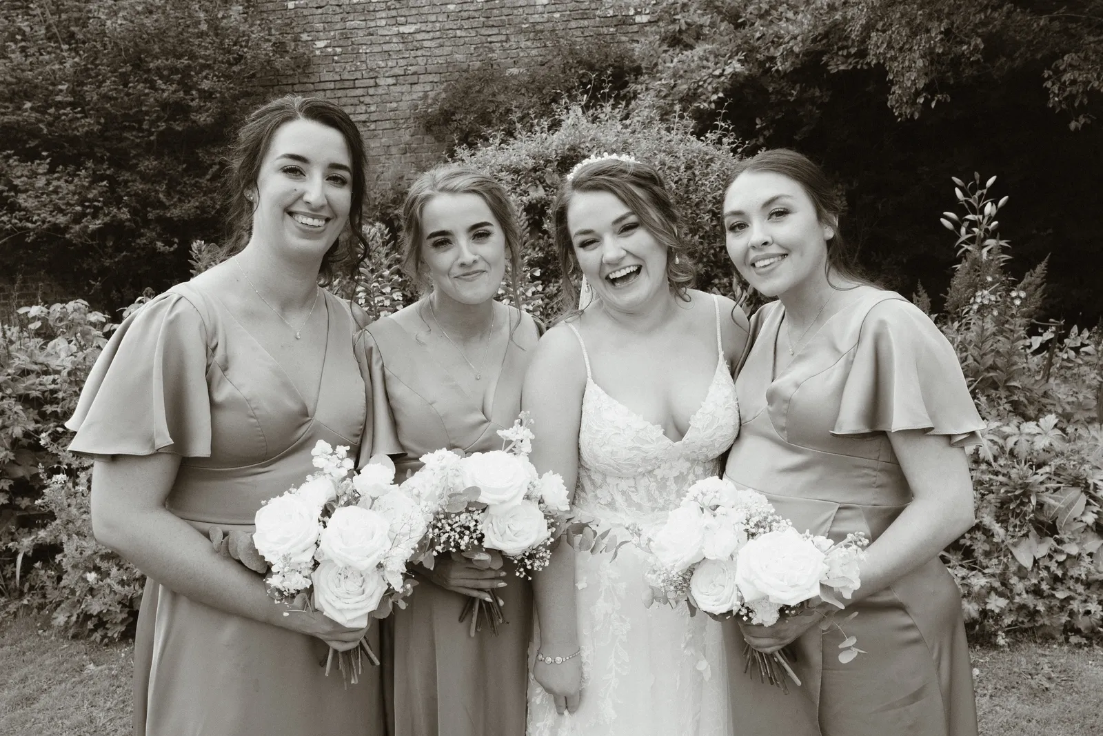 Claire with guests holding bouquets