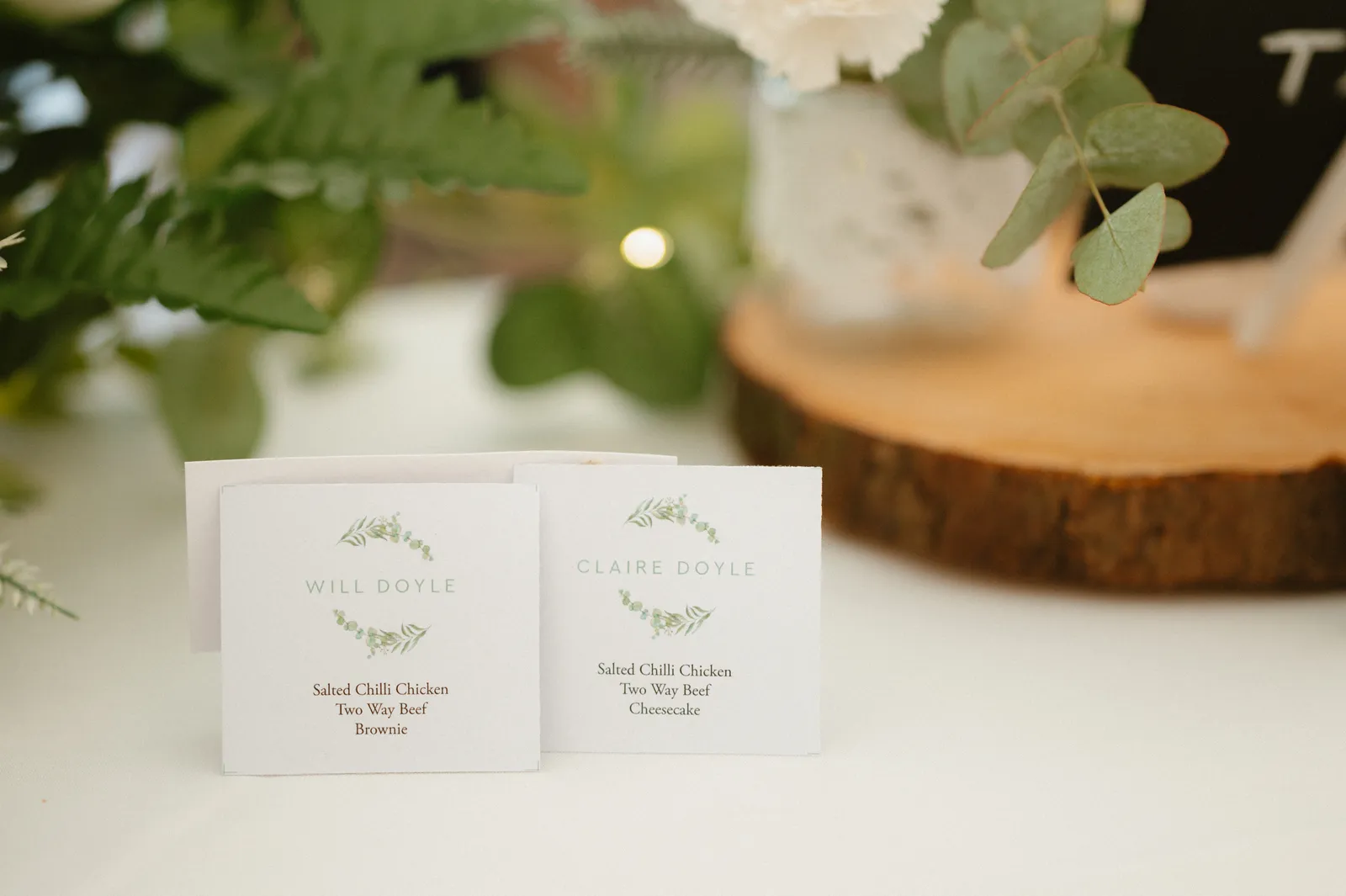 Small signs beside the wedding cake
