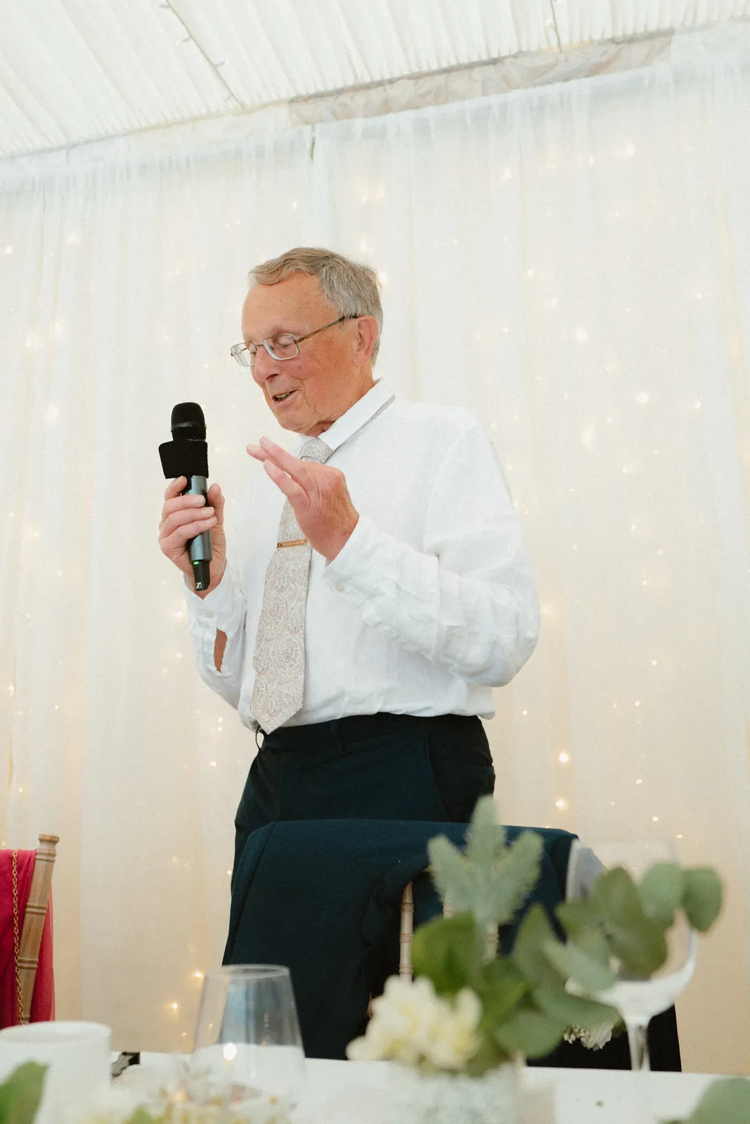 A speech beneath the marquee canopy