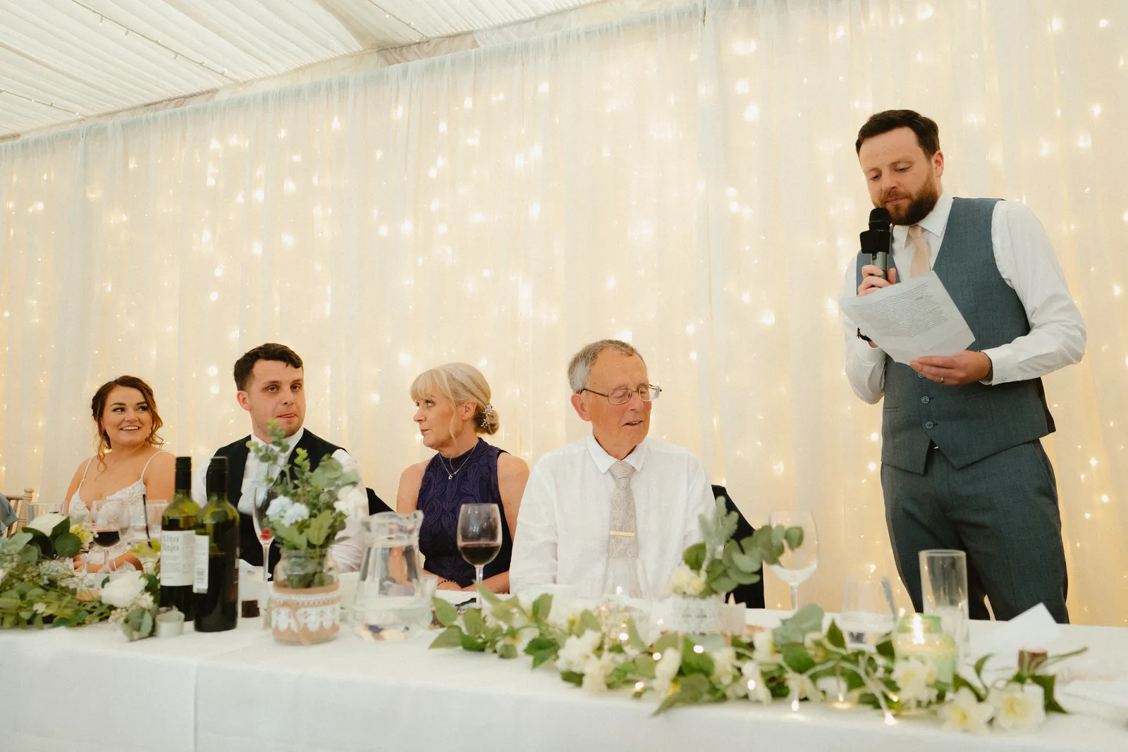 Guests listening around the top table