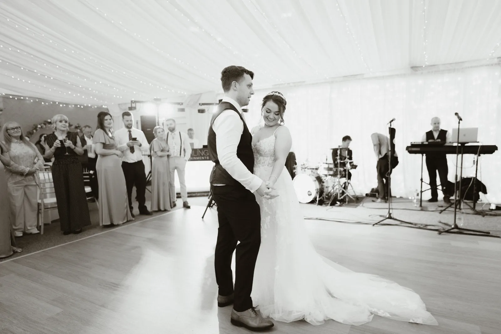 Claire and Will dancing in black and white