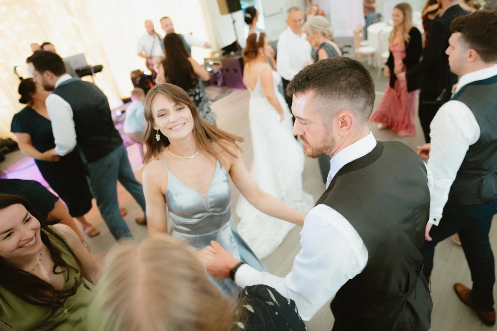 Guests smiling on the dance floor