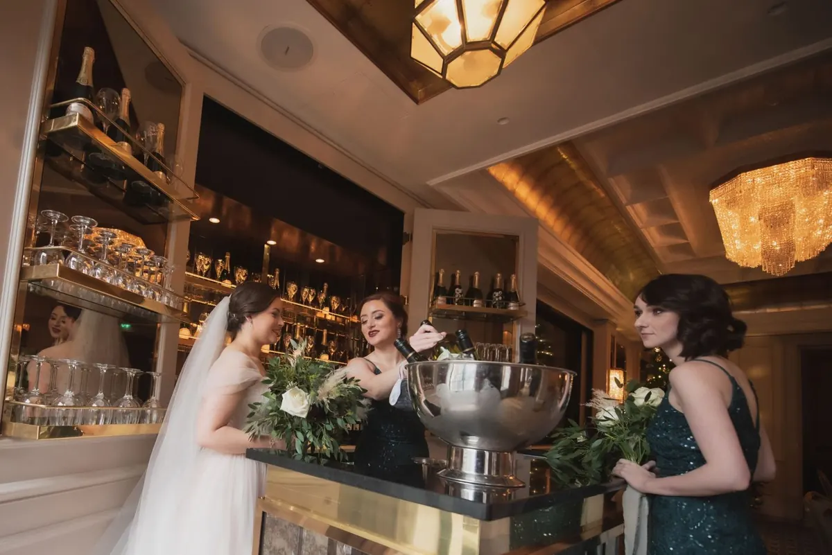 The bride and attendants gathered at the bar
