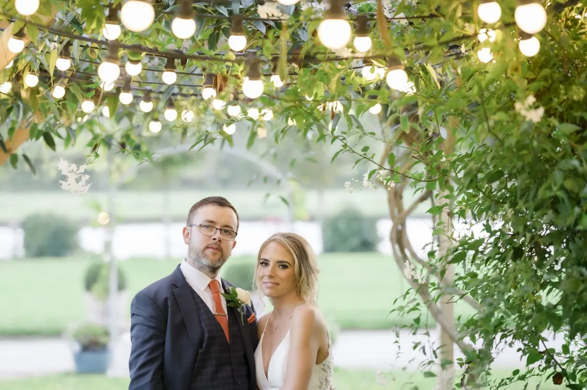 Charlie and Steven beneath the garden lights