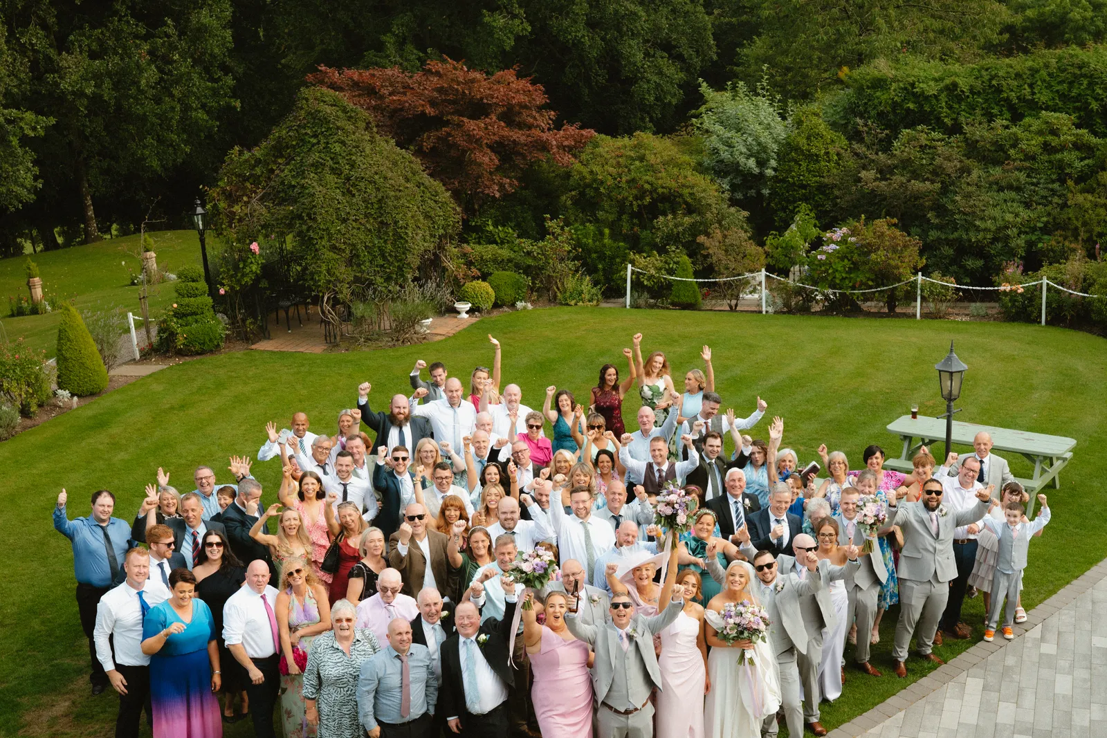 A large group gathered in the garden