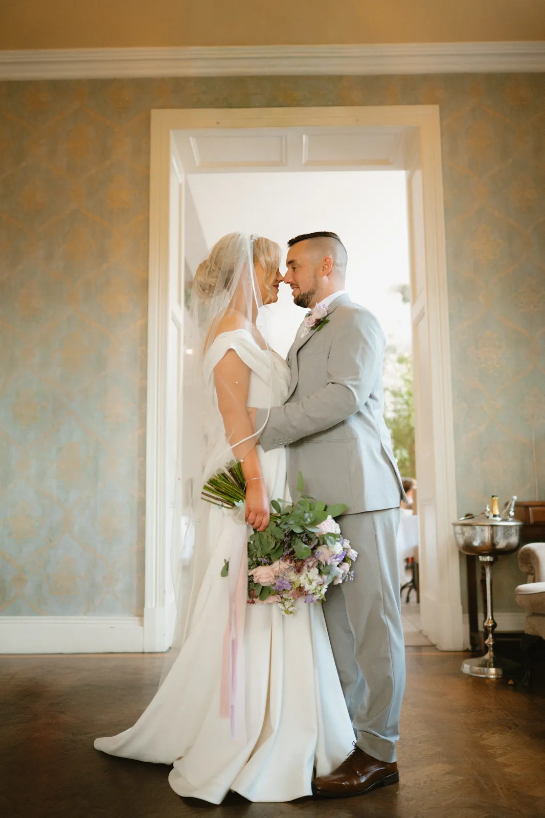 The couple framed by a doorway
