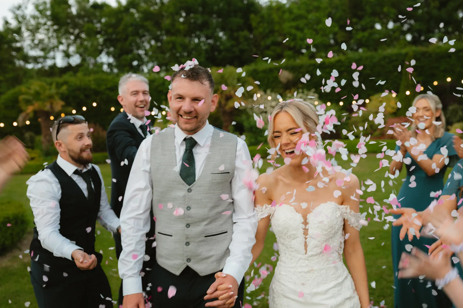Confetti falling around Hazel and Luke