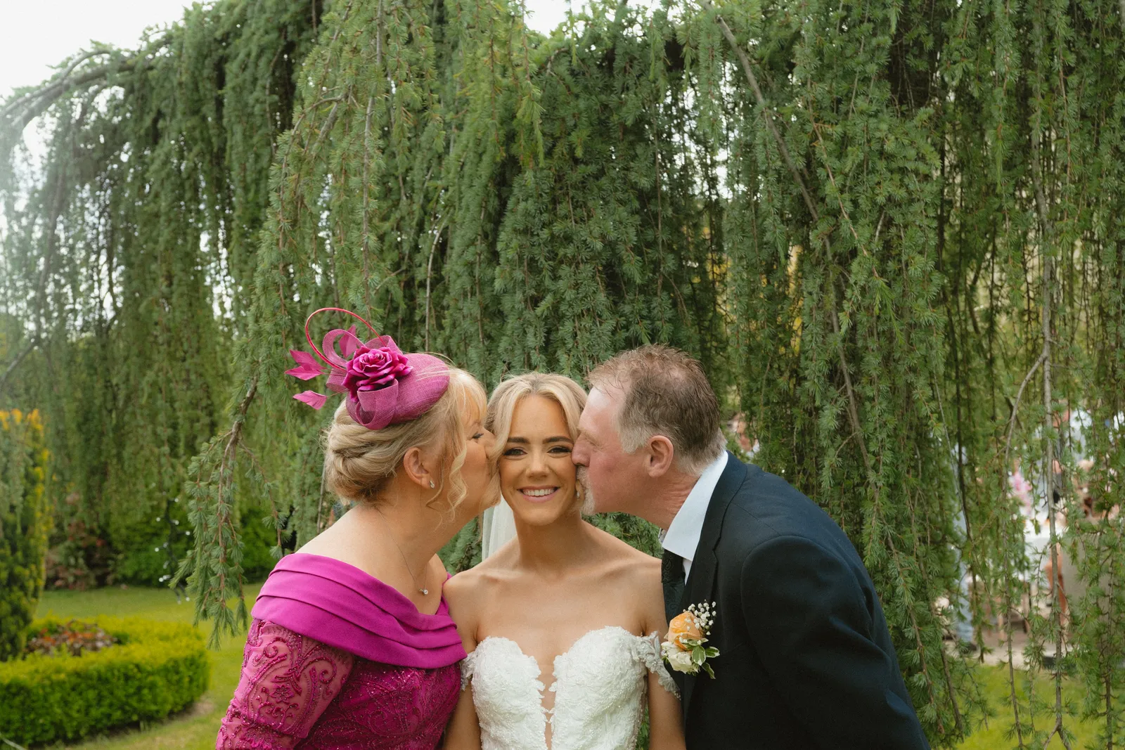 Guests kissing Hazel on the cheeks