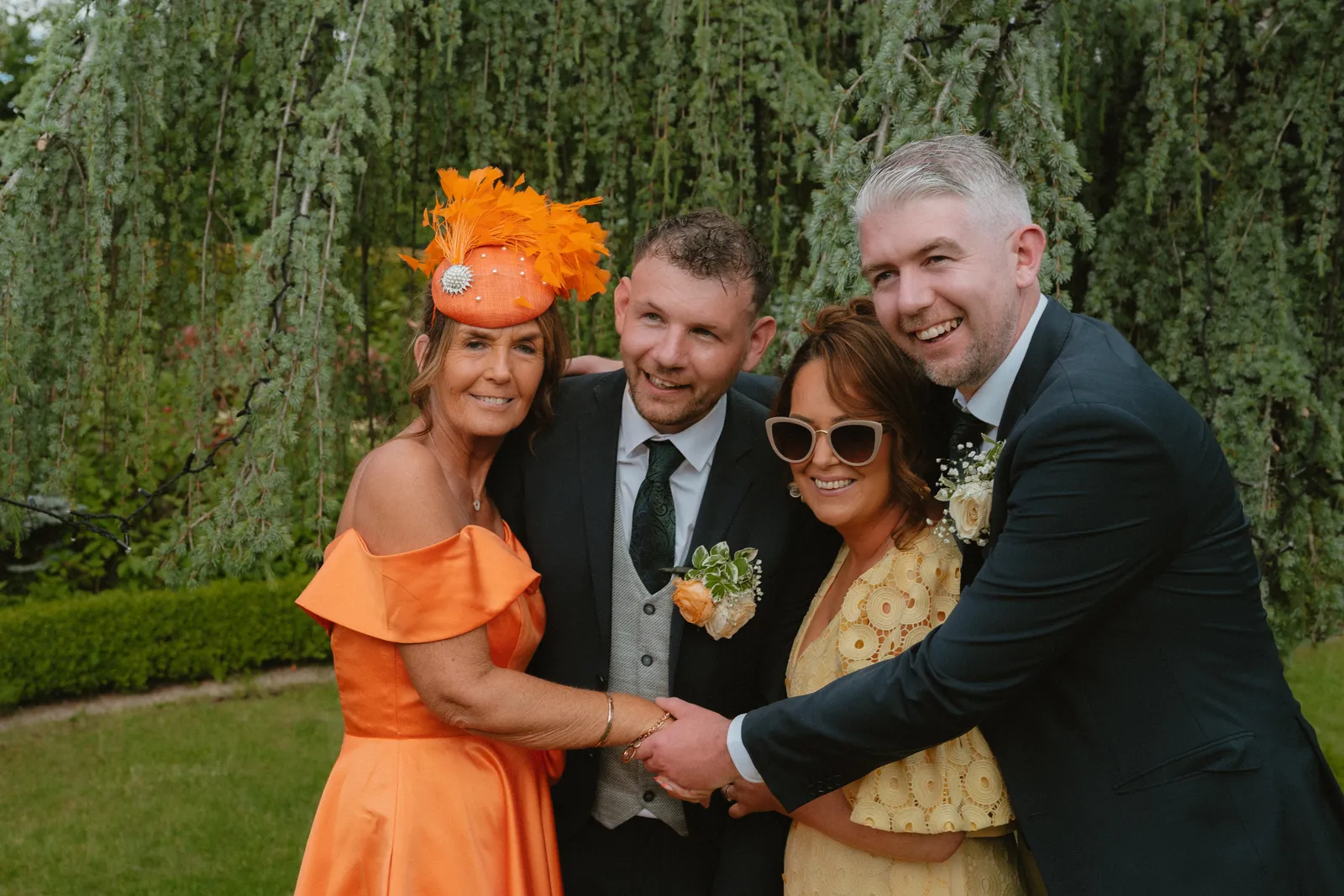 Luke with guests in bright dresses