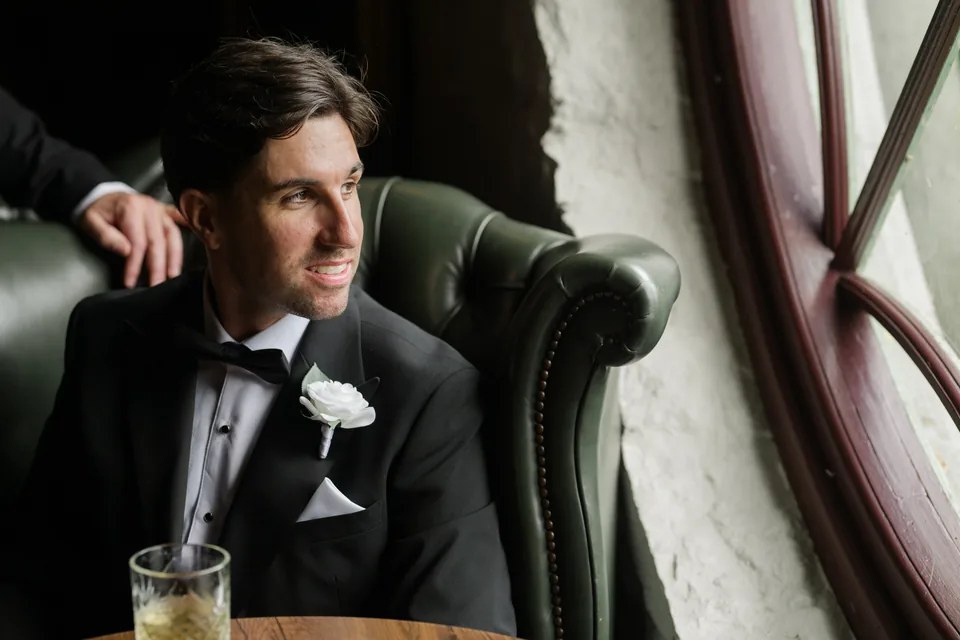 A relaxed groom portrait with rich interior colour.